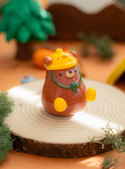 A cozy bear figurine with a duck hat and rain boots, kawaii handmade desk decor.