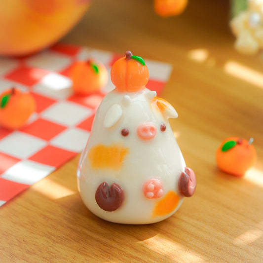 A cute, handcrafted white cow figurine cozy handmade desk buddy and figurine.